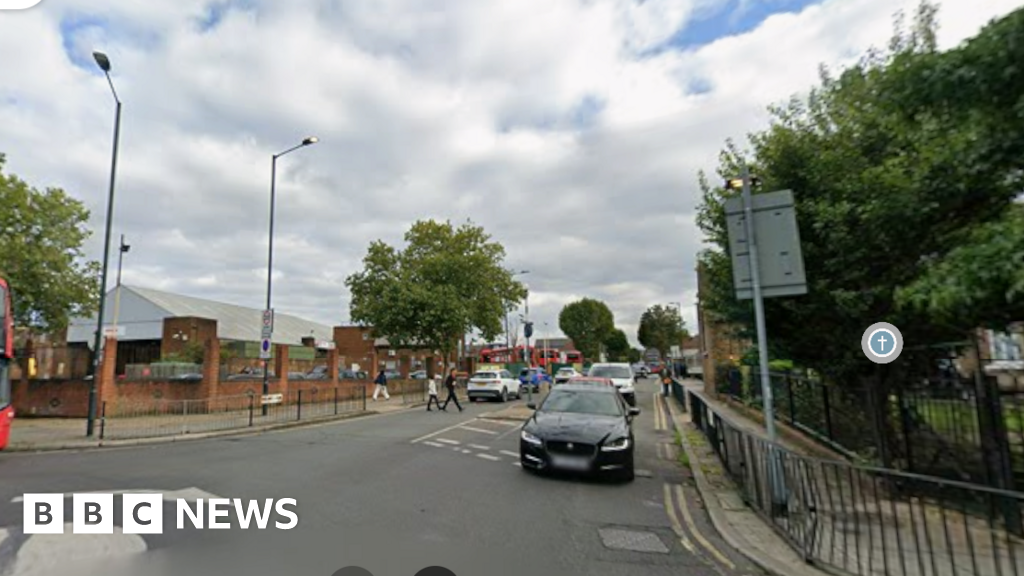 Arrest after woman, 50, stabbed to death on street