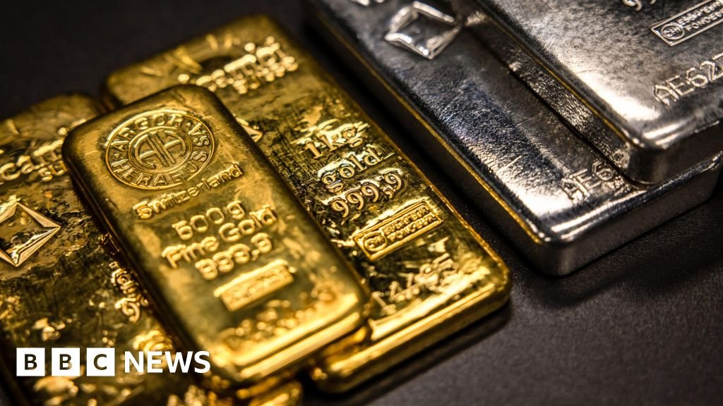 Gold and silver resume slide after Friday's plunge